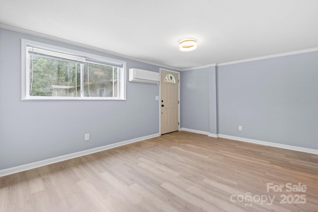 1175 Bamboo Rd, Boone, NC 28607 - spare room featuring an AC wall unit, ornamental molding, and light wood-style floors
