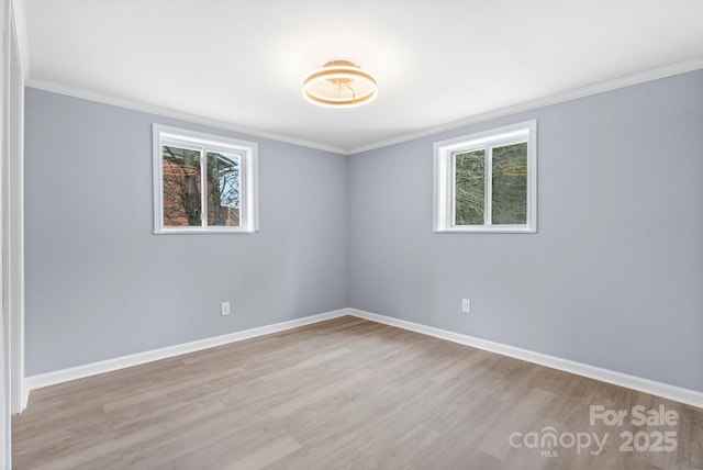 1175 Bamboo Rd, Boone, NC 28607 - empty room with wood finished floors, plenty of natural light, and ornamental molding