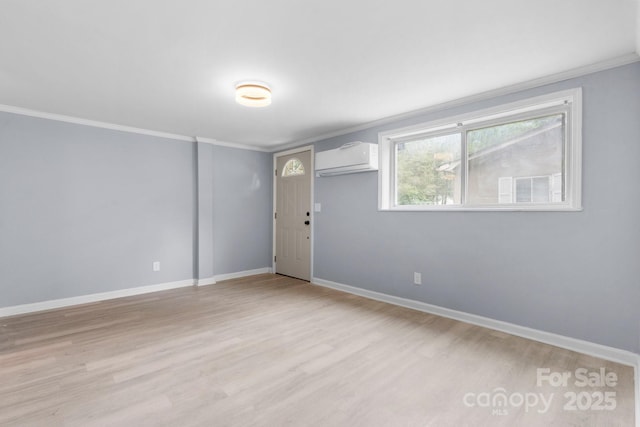1175 Bamboo Rd, Boone, NC 28607 - unfurnished room with a wall mounted AC, ornamental molding, and light wood-style floors