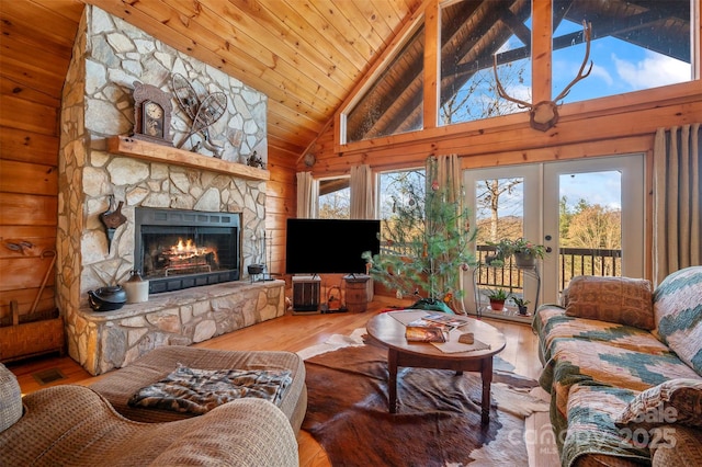 197 First Broad Dr, Bostic, NC 28018 - living room featuring a fireplace, wood finished floors, wood walls, wooden ceiling, and high vaulted ceiling