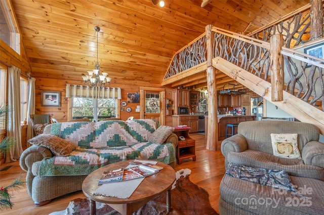 197 First Broad Dr, Bostic, NC 28018 - living area with a chandelier, light wood-type flooring, wood ceiling, high vaulted ceiling, and wooden walls
