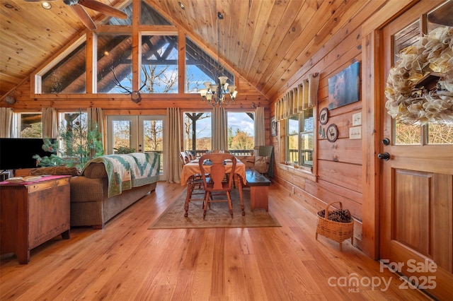 197 First Broad Dr, Bostic, NC 28018 - dining space featuring a chandelier, light wood-type flooring, wooden walls, lofted ceiling, and wood ceiling