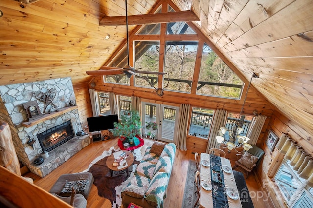 197 First Broad Dr, Bostic, NC 28018 - living room with a wood ceiling with exposed beams, a fireplace, hardwood / wood-style flooring, high vaulted ceiling, and wood walls