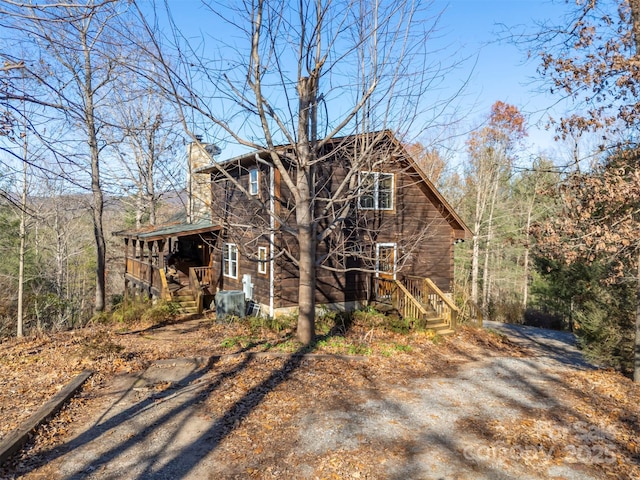 197 First Broad Dr, Bostic, NC 28018 - view of home's exterior with a chimney