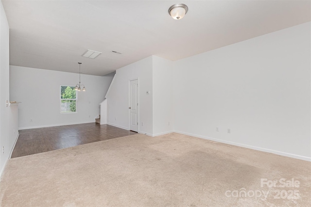 1404 Waylon Ave, Gastonia, NC 28054 - spare room featuring carpet floors, a chandelier, and stairs