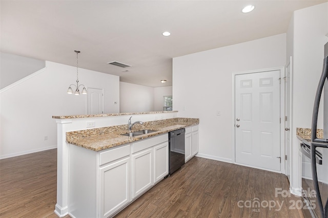 1404 Waylon Ave, Gastonia, NC 28054 - kitchen with dishwashing machine, a peninsula, dark wood-style floors, light stone countertops, and white cabinets