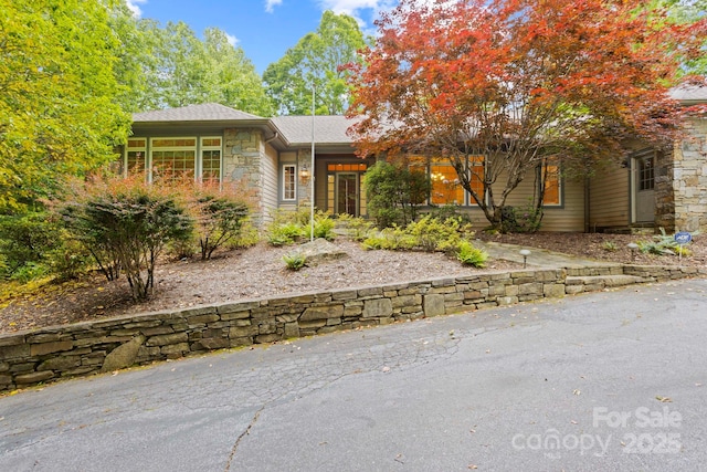 132 Berry Creek Dr, Flat Rock, NC 28731 - view of front of home with stone siding and roof with shingles