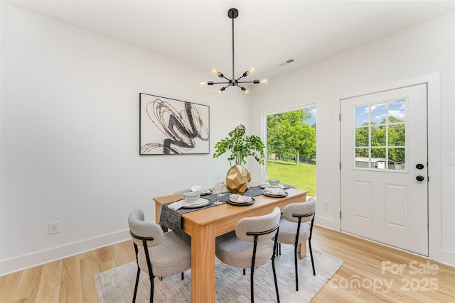 3486 Winters St, Newton, NC 28658 - dining area featuring a chandelier and light wood-style flooring