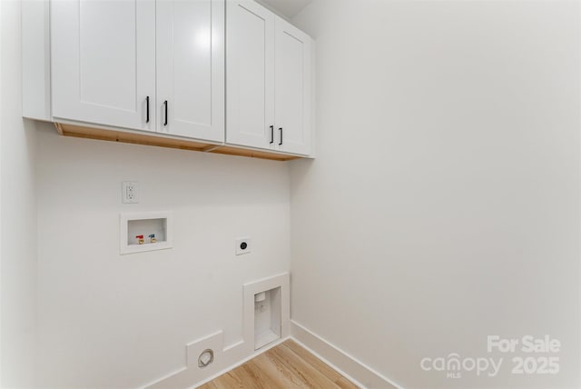 3486 Winters St, Newton, NC 28658 - laundry area featuring cabinet space, hookup for an electric dryer, light wood finished floors, and hookup for a washing machine