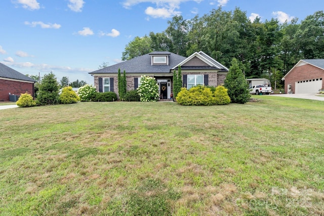 203 Poplins Grove Church Rd, Albemarle, NC 28001 - view of front of house featuring brick siding, a front yard, and a garage