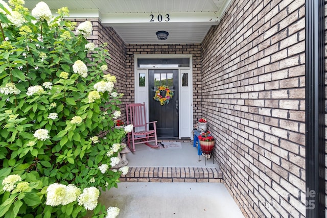 203 Poplins Grove Church Rd, Albemarle, NC 28001 - entrance to property featuring brick siding and a porch