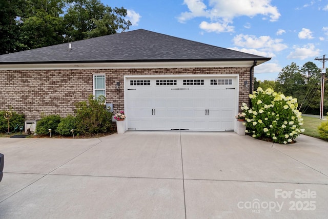 203 Poplins Grove Church Rd, Albemarle, NC 28001 - view of side of home with concrete driveway, a shingled roof, and a garage