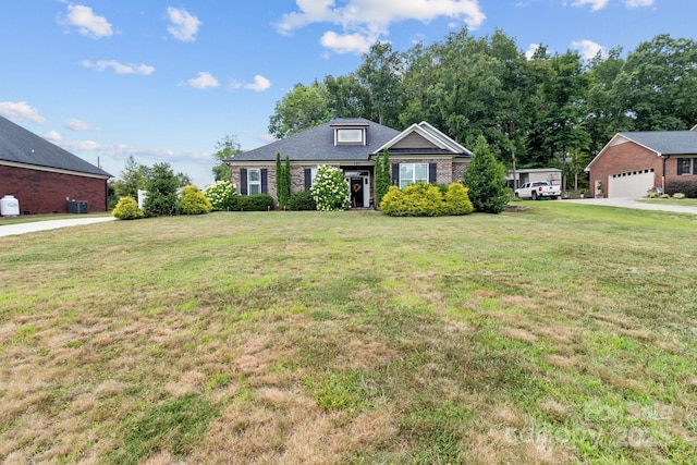 203 Poplins Grove Church Rd, Albemarle, NC 28001 - view of front of house featuring a front yard and brick siding