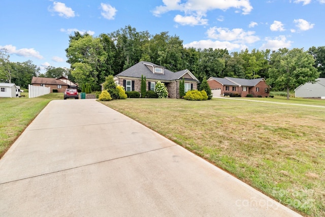 203 Poplins Grove Church Rd, Albemarle, NC 28001 - view of front of house with concrete driveway, a front lawn, and brick siding