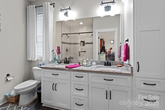 203 Poplins Grove Church Rd, Albemarle, NC 28001 - bathroom with double vanity, a shower stall, and wood finished floors