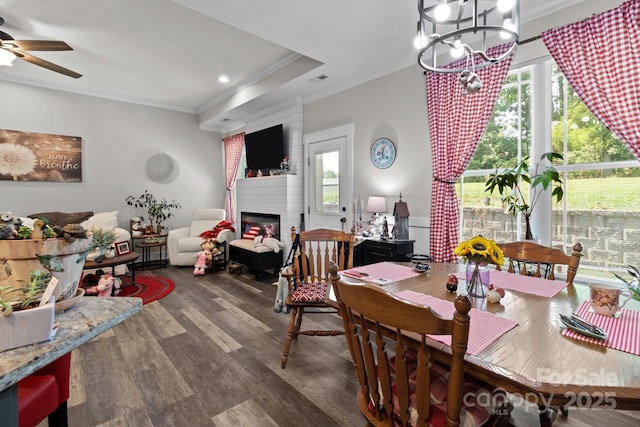 203 Poplins Grove Church Rd, Albemarle, NC 28001 - dining room with ornamental molding, wood finished floors, a chandelier, ceiling fan, and a large fireplace
