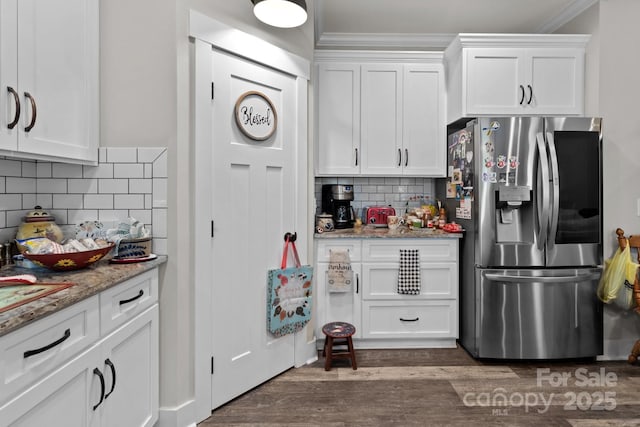 203 Poplins Grove Church Rd, Albemarle, NC 28001 - kitchen with stainless steel fridge with ice dispenser, white cabinets, tasteful backsplash, ornamental molding, and dark wood finished floors