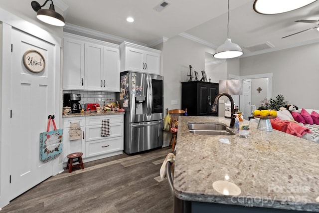 203 Poplins Grove Church Rd, Albemarle, NC 28001 - kitchen featuring stainless steel refrigerator with ice dispenser, ornamental molding, white cabinets, dark wood-style floors, and backsplash