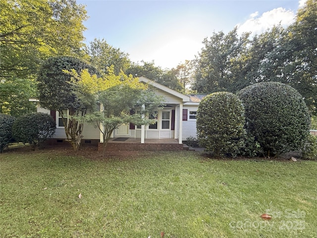 400 Archibald Rd, Concord, NC 28025 - view of front of house featuring a front yard, a porch, and crawl space