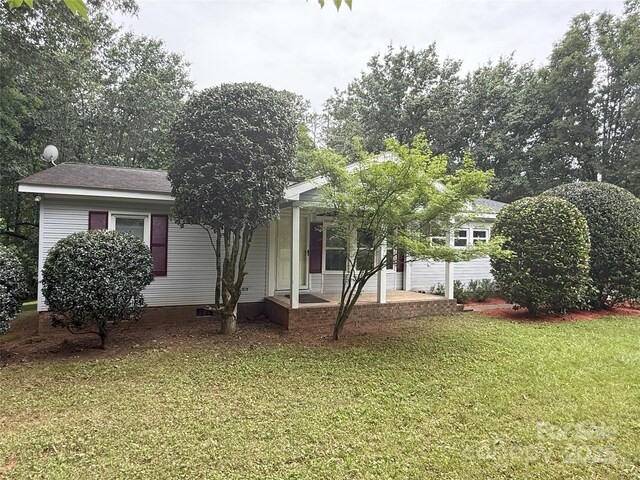 400 Archibald Rd, Concord, NC 28025 - view of property hidden behind natural elements featuring a front yard, covered porch, and crawl space