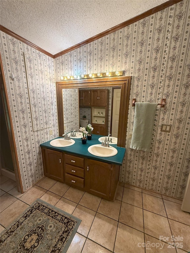 400 Archibald Rd, Concord, NC 28025 - full bath with ornamental molding, tile patterned floors, a textured ceiling, double vanity, and wallpapered walls