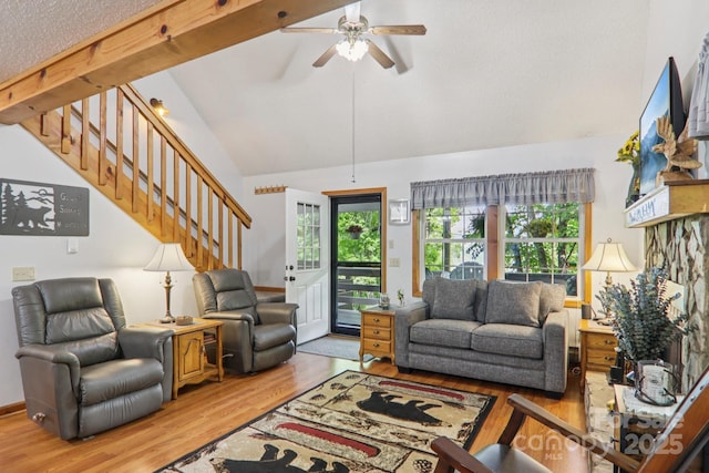 84 Hawk Nest Rd, Maggie Valley, NC 28751 - living room featuring lofted ceiling, stairs, wood finished floors, and a ceiling fan