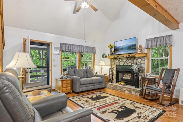 84 Hawk Nest Rd, Maggie Valley, NC 28751 - living room featuring wood finished floors, a fireplace, ceiling fan, and high vaulted ceiling