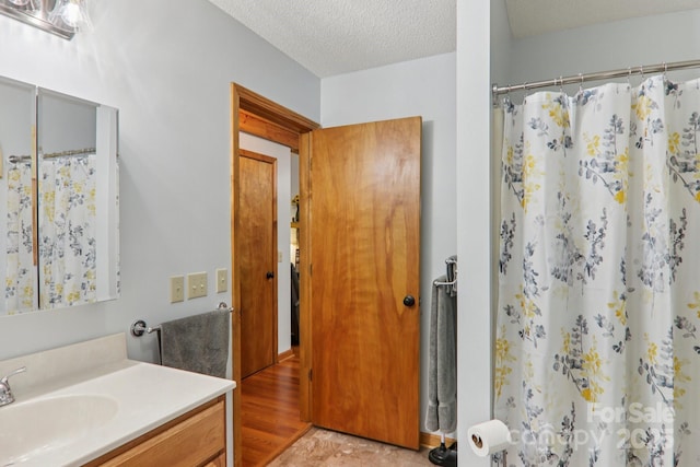 84 Hawk Nest Rd, Maggie Valley, NC 28751 - full bathroom featuring vanity, a textured ceiling, and a shower with shower curtain