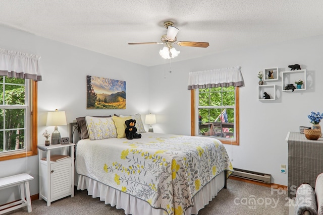 84 Hawk Nest Rd, Maggie Valley, NC 28751 - carpeted bedroom featuring baseboard heating and ceiling fan