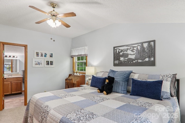 84 Hawk Nest Rd, Maggie Valley, NC 28751 - bedroom featuring carpet floors, vaulted ceiling, a textured ceiling, ensuite bathroom, and ceiling fan