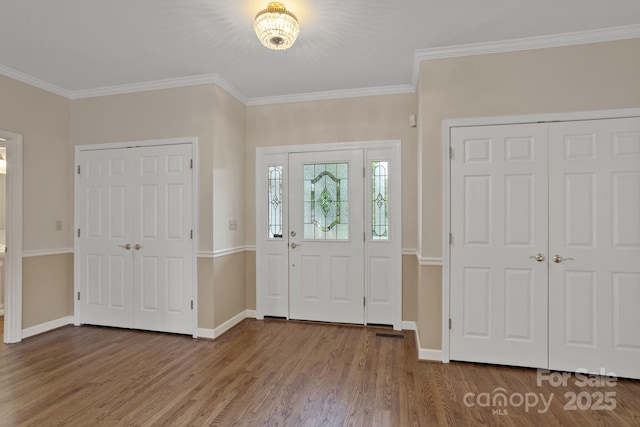 390 Classic Oaks Cir, Hendersonville, NC 28792 - foyer entrance featuring wood finished floors and crown molding