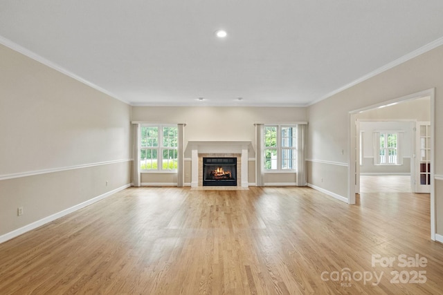 390 Classic Oaks Cir, Hendersonville, NC 28792 - unfurnished living room featuring healthy amount of natural light, light wood finished floors, a fireplace, ornamental molding, and recessed lighting