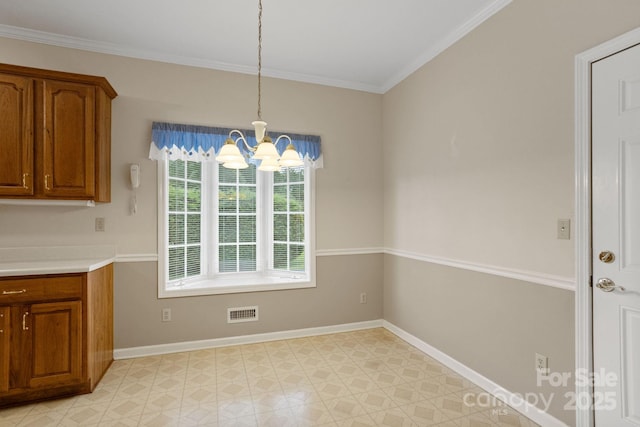 390 Classic Oaks Cir, Hendersonville, NC 28792 - unfurnished dining area featuring a chandelier and crown molding