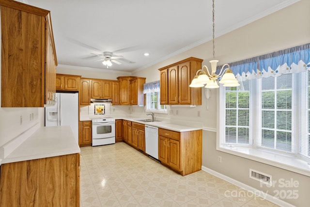390 Classic Oaks Cir, Hendersonville, NC 28792 - kitchen with white appliances, brown cabinets, under cabinet range hood, a chandelier, and crown molding
