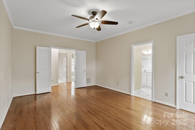 390 Classic Oaks Cir, Hendersonville, NC 28792 - unfurnished bedroom featuring hardwood / wood-style floors, crown molding, and ensuite bath