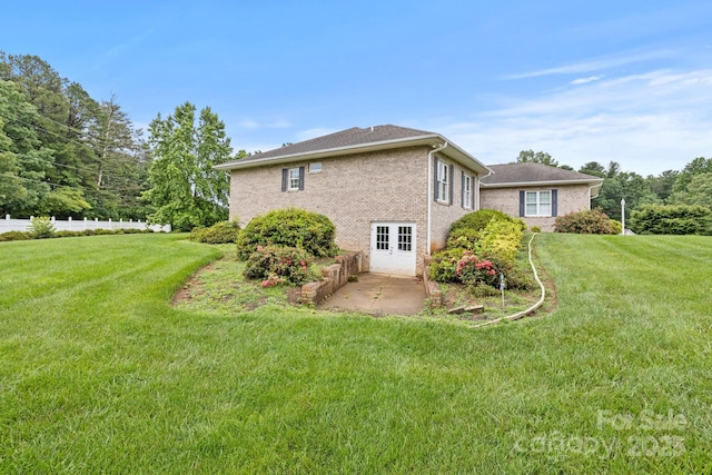 390 Classic Oaks Cir, Hendersonville, NC 28792 - view of side of home with brick siding, a yard, and a patio area