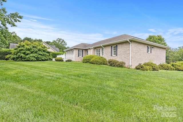 390 Classic Oaks Cir, Hendersonville, NC 28792 - view of property exterior with a lawn and brick siding