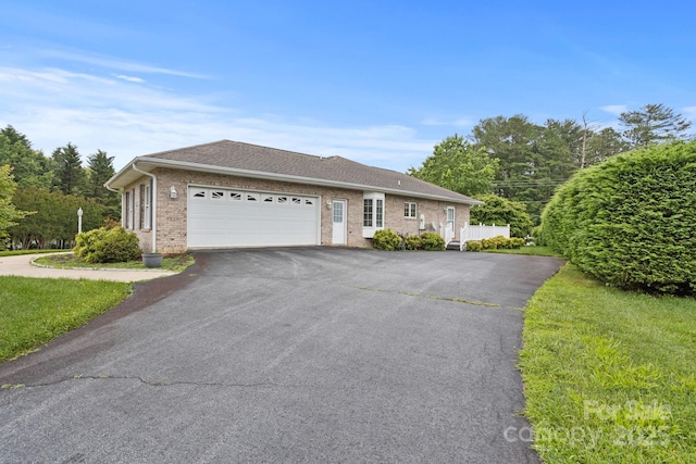 390 Classic Oaks Cir, Hendersonville, NC 28792 - ranch-style home featuring asphalt driveway, brick siding, a garage, and a shingled roof