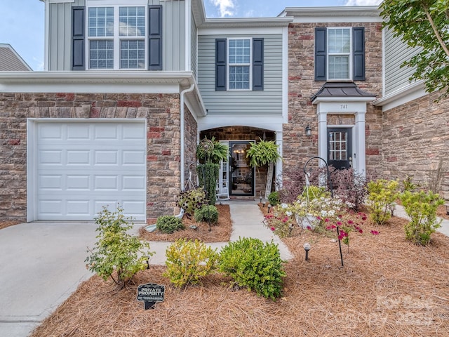 739 Elders Story Rd, Fort Mill, SC 29708 - view of front of property featuring driveway, an attached garage, stone siding, and board and batten siding