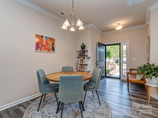 739 Elders Story Rd, Fort Mill, SC 29708 - dining space featuring a chandelier, ornamental molding, and wood finished floors