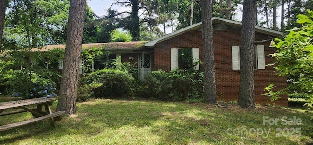 1116 Bryce Ave, Salisbury, NC 28144 - view of front facade featuring brick siding and a front yard