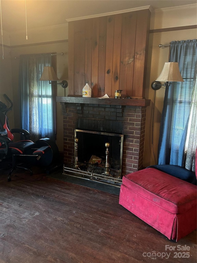 3220 Harmony Hwy, Harmony, NC 28634 - living area with ornamental molding, wood finished floors, and a brick fireplace