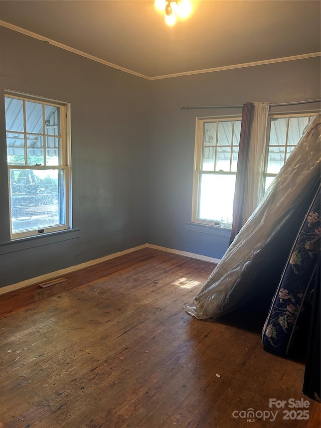 3220 Harmony Hwy, Harmony, NC 28634 - empty room with crown molding and wood-type flooring