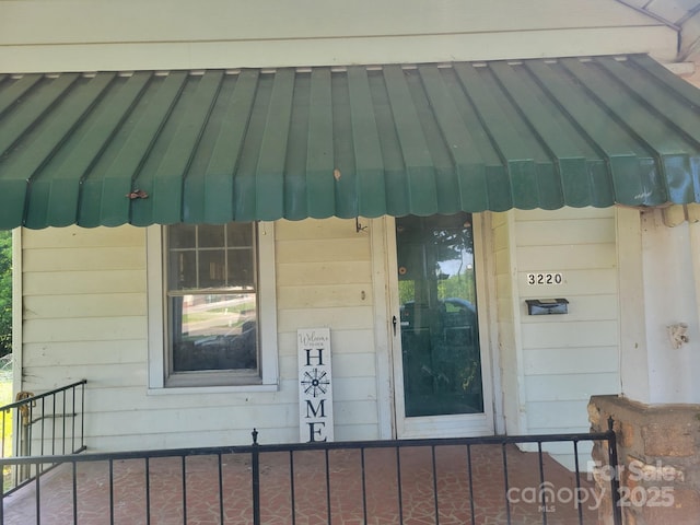 3220 Harmony Hwy, Harmony, NC 28634 - property entrance featuring a standing seam roof and a metal roof