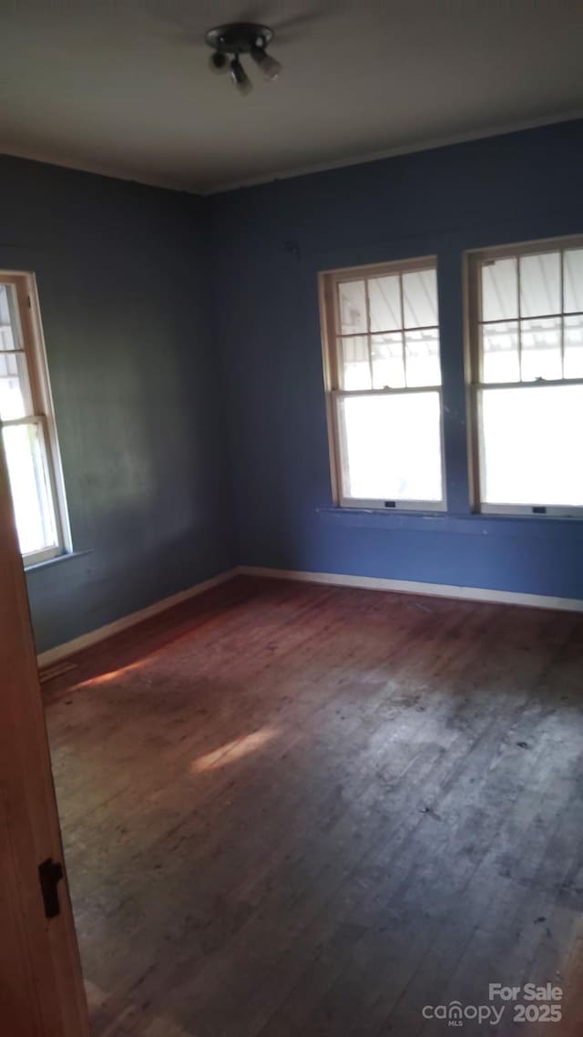 3220 Harmony Hwy, Harmony, NC 28634 - empty room featuring wood finished floors and ornamental molding