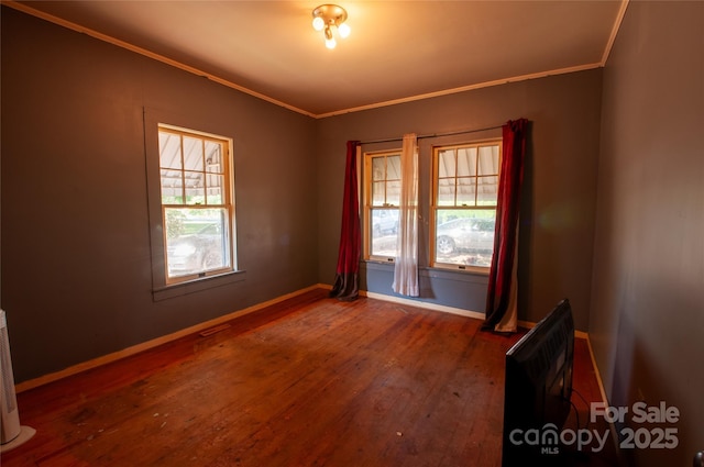 3220 Harmony Hwy, Harmony, NC 28634 - empty room featuring wood-type flooring and crown molding