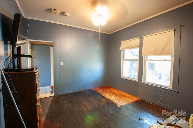 3220 Harmony Hwy, Harmony, NC 28634 - empty room with wood finished floors, ornamental molding, and a smoke detector