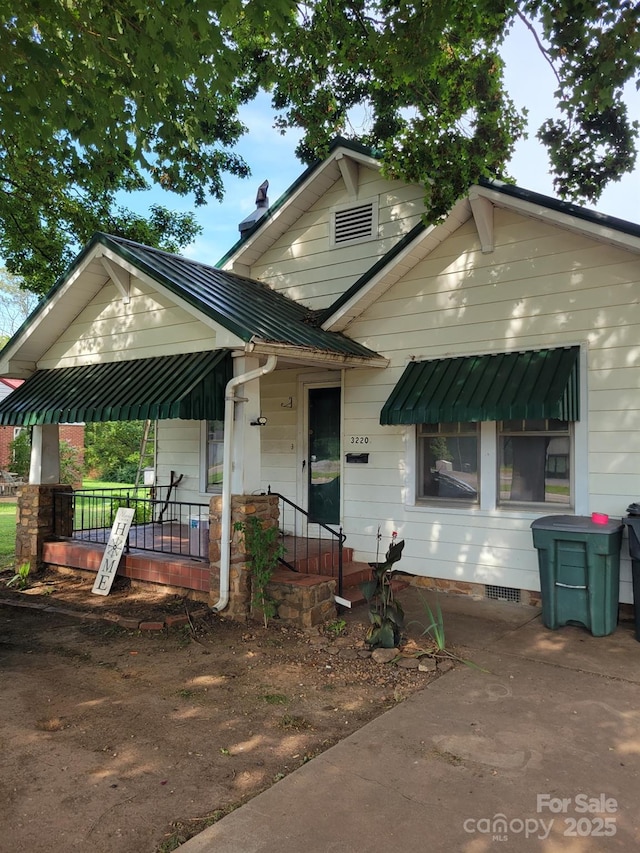 3220 Harmony Hwy, Harmony, NC 28634 - view of front of home featuring crawl space and a porch
