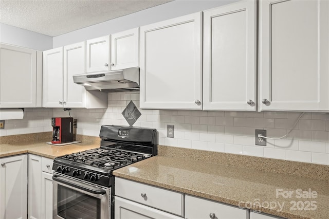 171 Highland Woods Ct, Denver, NC 28037 - kitchen with gas range, under cabinet range hood, white cabinets, light stone countertops, and a textured ceiling