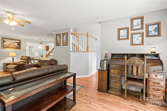 171 Highland Woods Ct, Denver, NC 28037 - living room with a ceiling fan, stairway, and wood finished floors